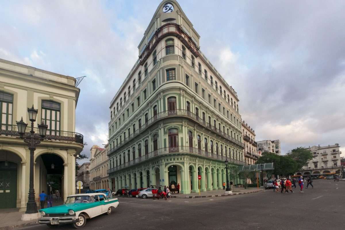 vintage car on street near buildings